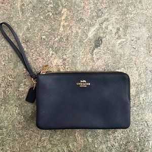 Coach medium wristlet with slots for credit cards.